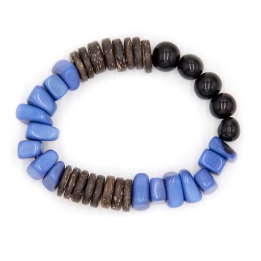 A three colored tagua bracelet made from vegetable ivory, featuring a variety of tagua slices and dried acai berries strung together.