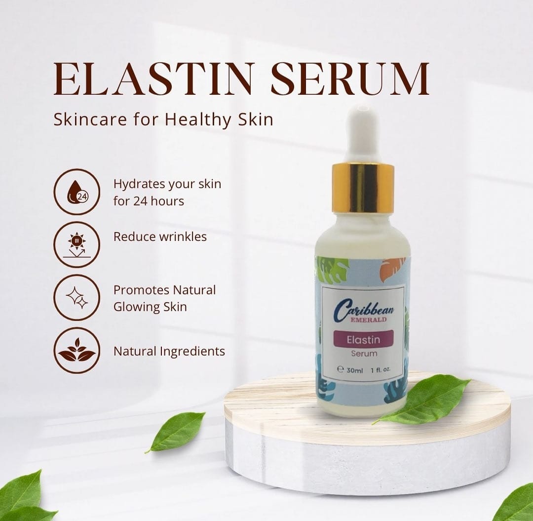 Light-colored bottle of Caribbean Emerald Elastin Serum with a white dropper cap, featuring a tropical leaf design on the label, placed on a white surface with green leaves around