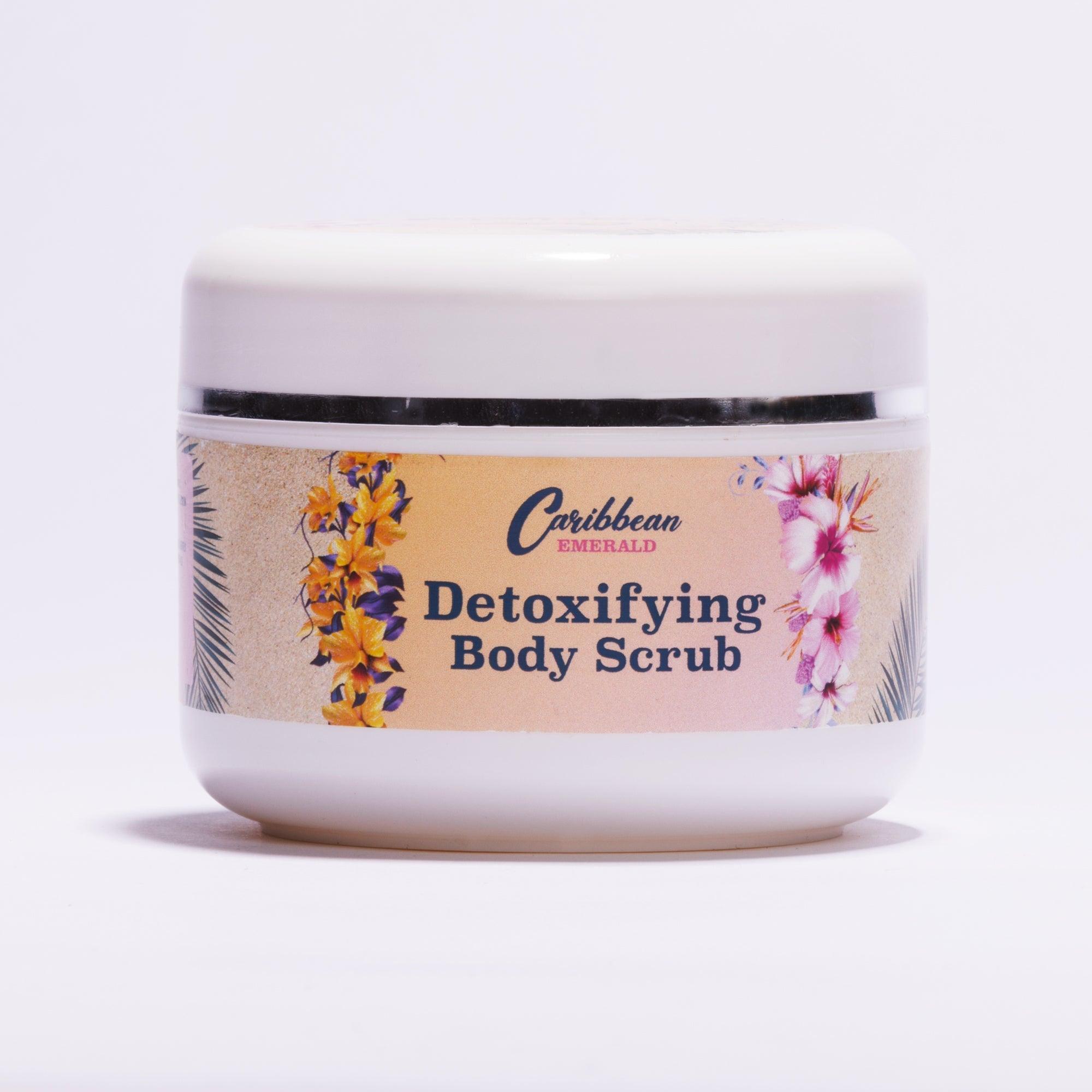 Caribbean Emerald Detoxifying Body Scrub in a white jar with tropical floral design.