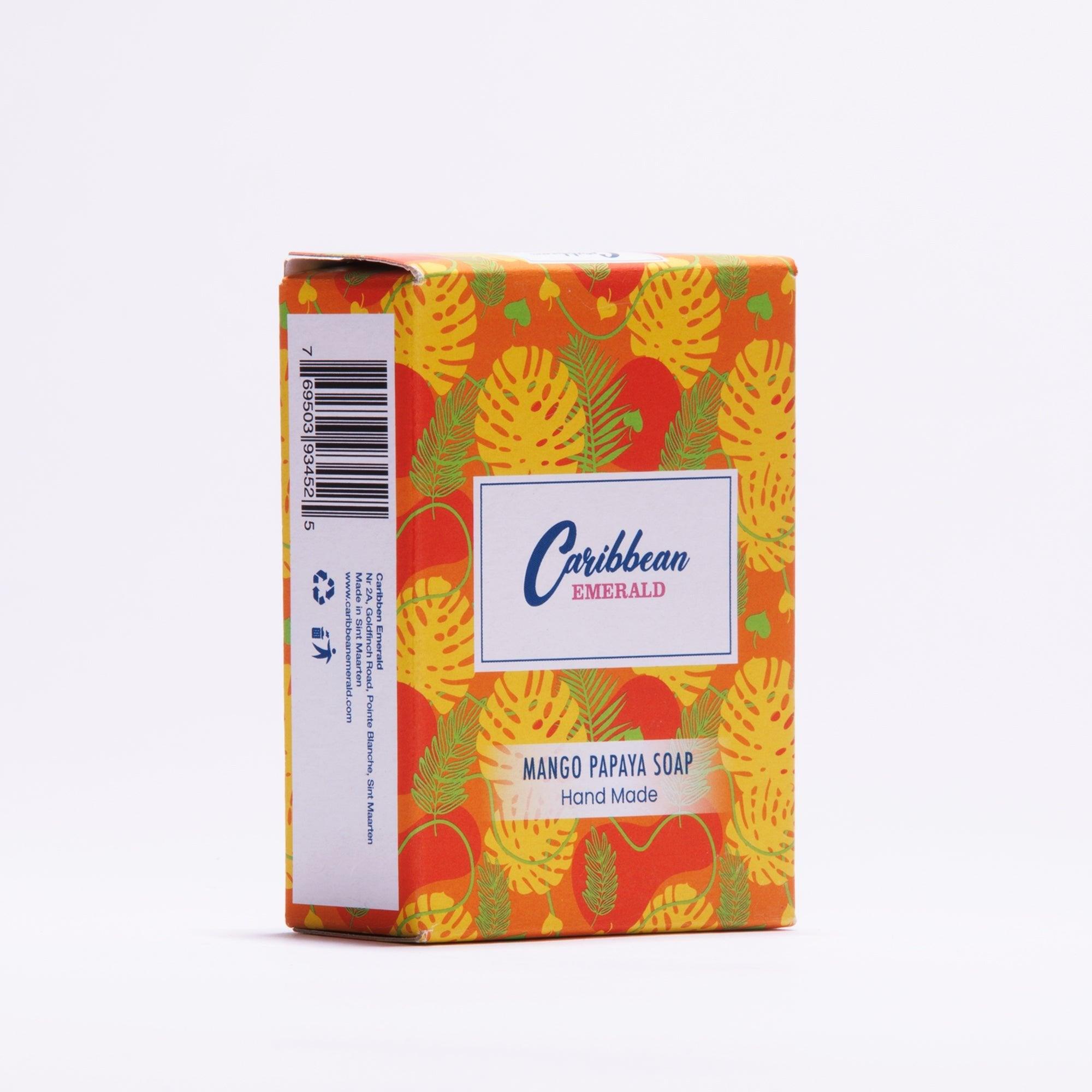 Handmade mango papaya soap bar in colorful tropical fruit patterned packaging.