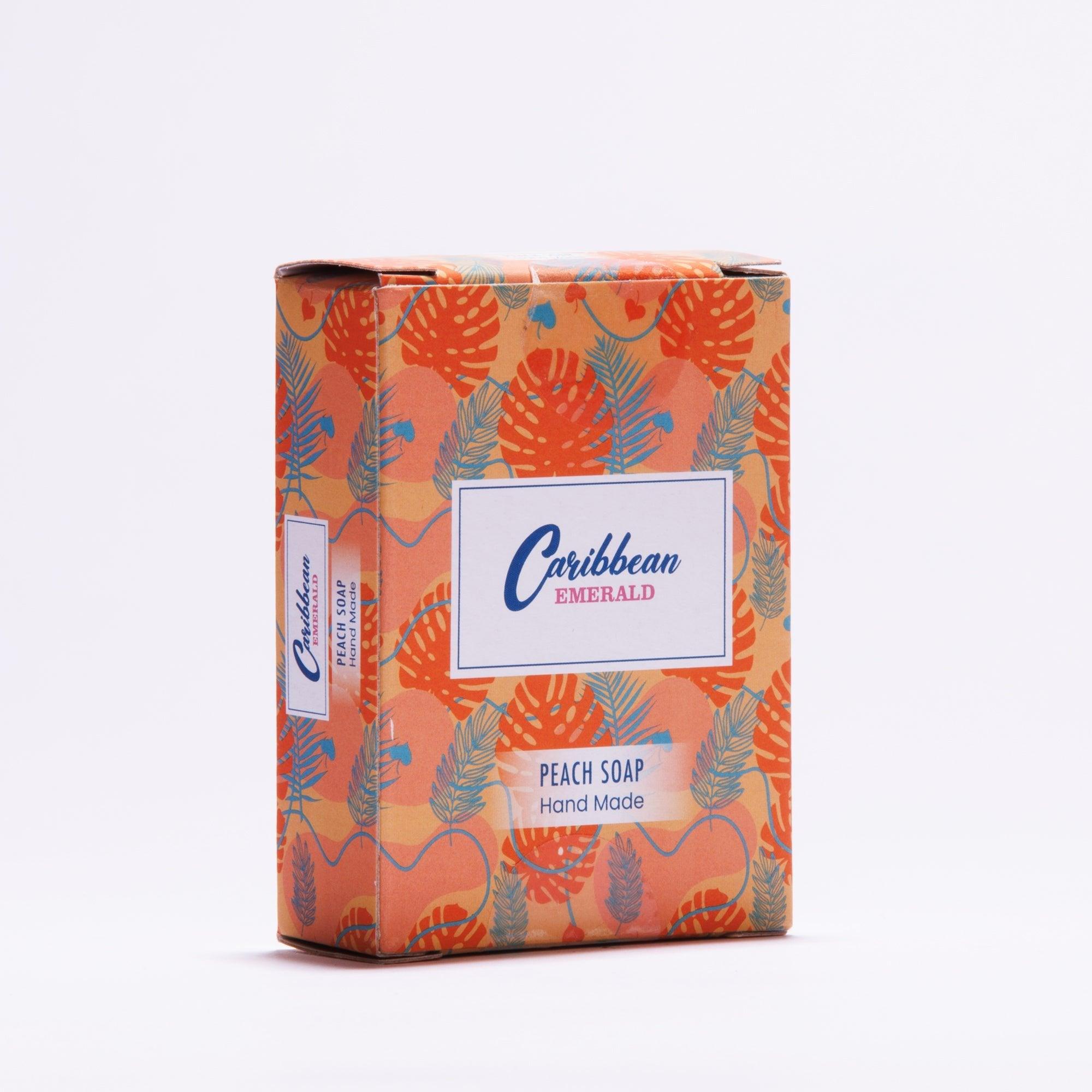 Caribbean Emerald handmade peach soap bar in tropical orange patterned packaging.