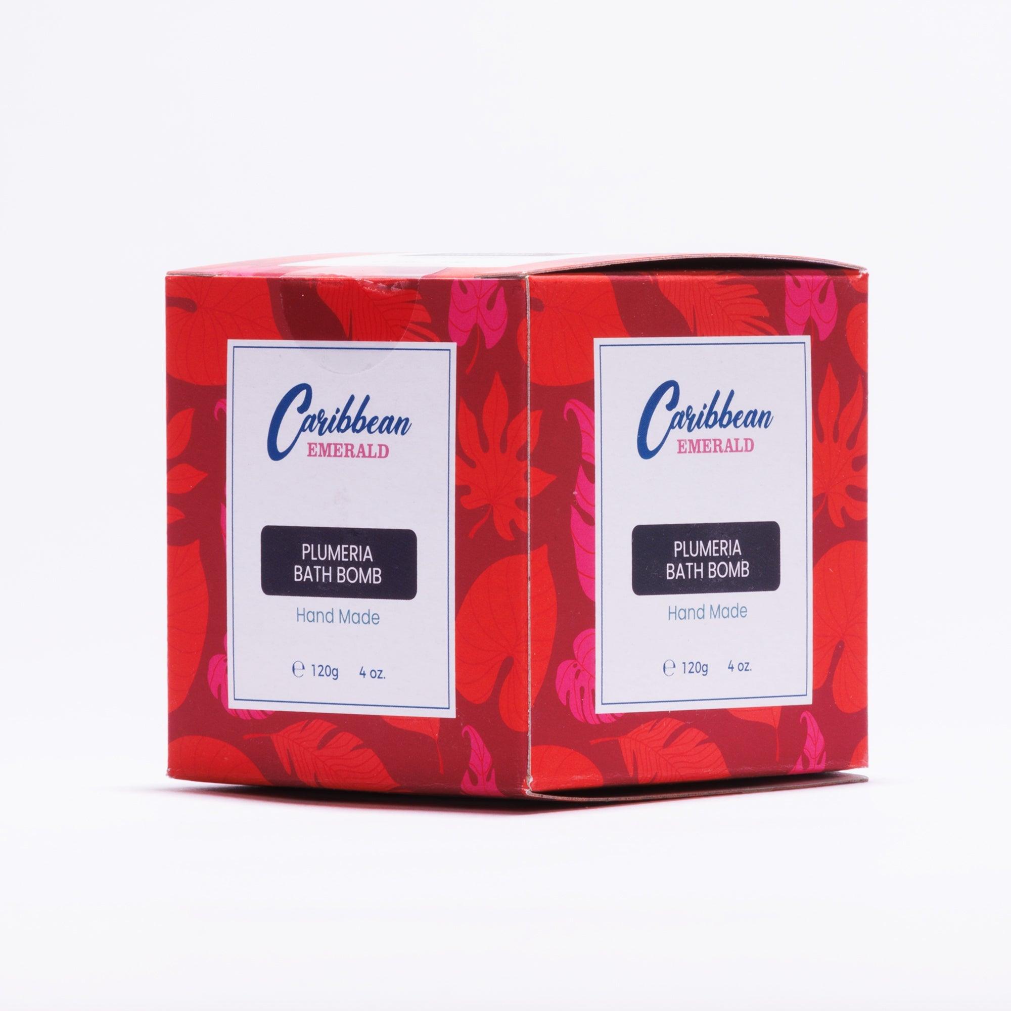 Two boxes of Plumeria Bath Bomb hand made skincare products in red floral packaging.
